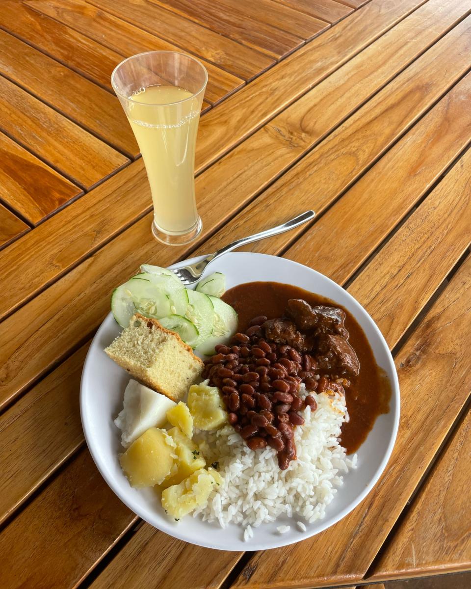 A RICA meal including the Rwandan food staples and fresh pineapple juice.
Photo Credit: Anna Newcome
