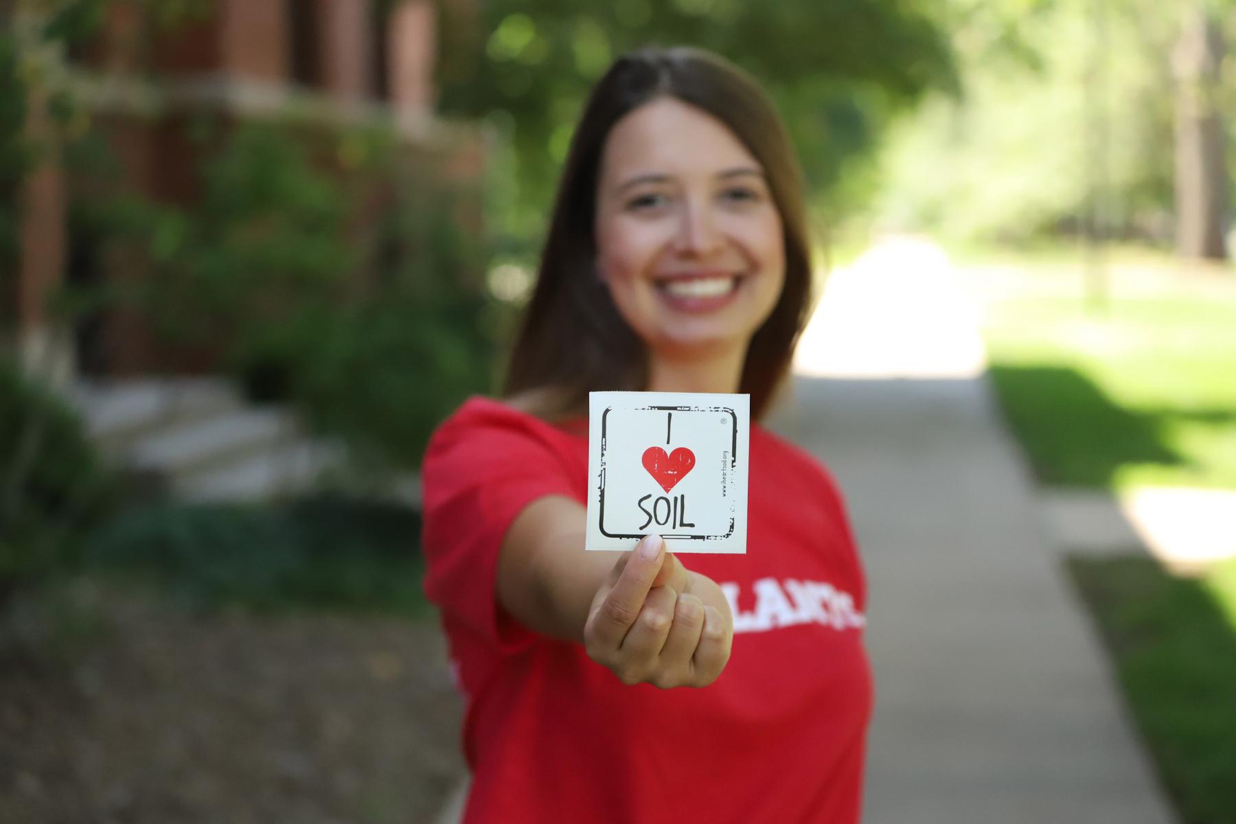 Fernanda Krupek, agronomy and horticulture doctoral student, shows off her love for soil at the East Campus Discovery Days and Farmer’s Market on June 12. The event will be held again 10 a.m. to 2 p.m. on July 10 and Aug. 14. More information at https://discoverydays.unl.edu.