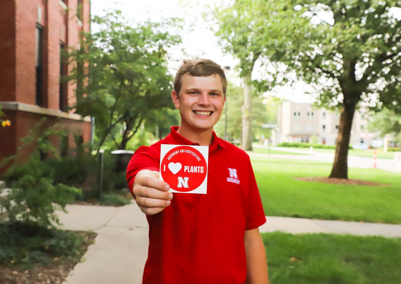 Jared Stander, senior agronomy major and Crops Judging Team coach, shows off his love of plants! 