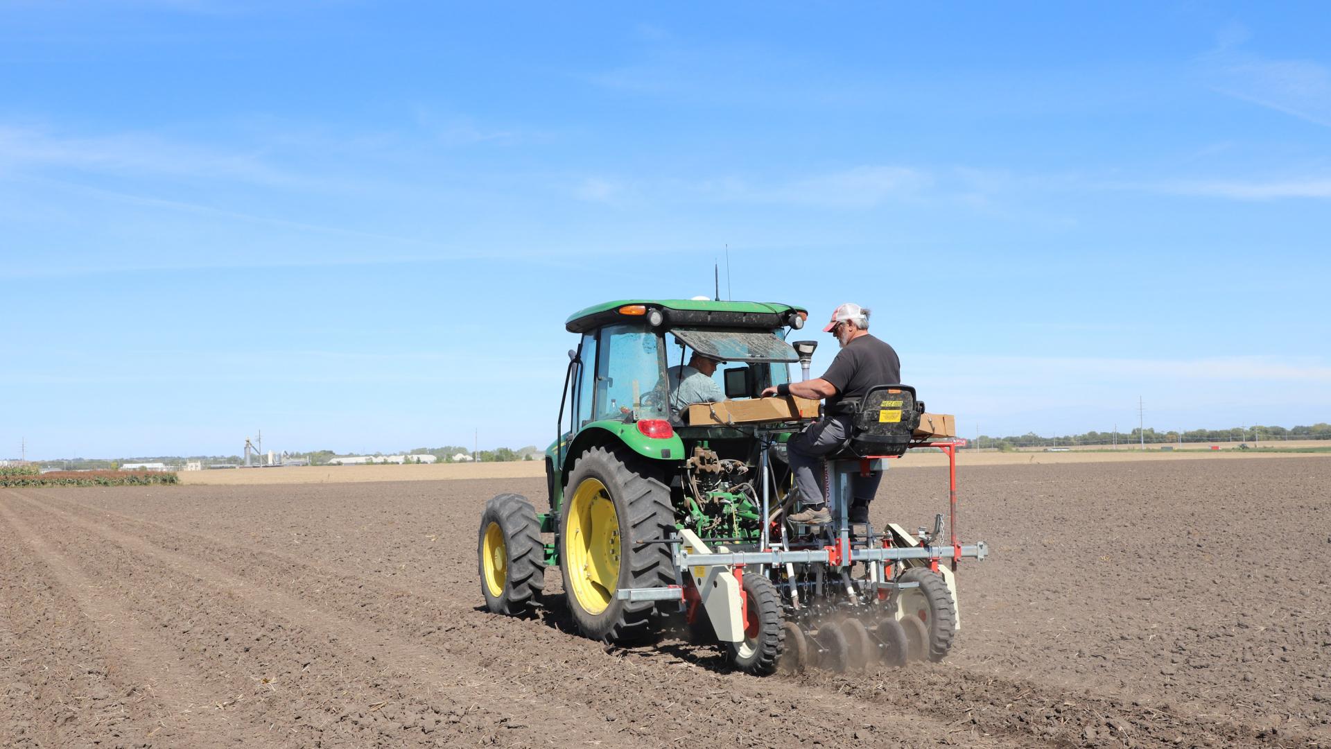 Mitch Montgomery and Greg Dorn plant winter wheat at Havelock Farm