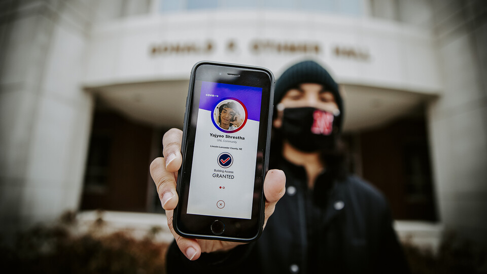 Nebraska’s Yajvoo Shrestha shows the Safer Community app to be used as part of COVID testing on campus this spring. Craig Chandler | University Communication