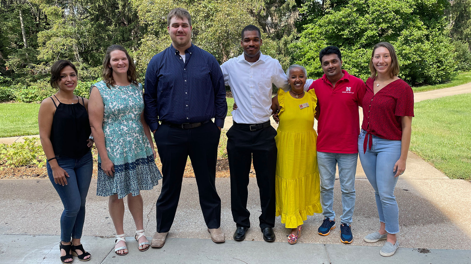  Agronomy and Horticulture Department Head Martha Mamo (third from right) celebrates with Elnazsadat Hosseinighdam (from left), Lindsey Overmyer, Shawn McDonald, Kailon Lang, Dinesh Panday and Jasmine Mausbach at the department graduation reception Aug. 13.