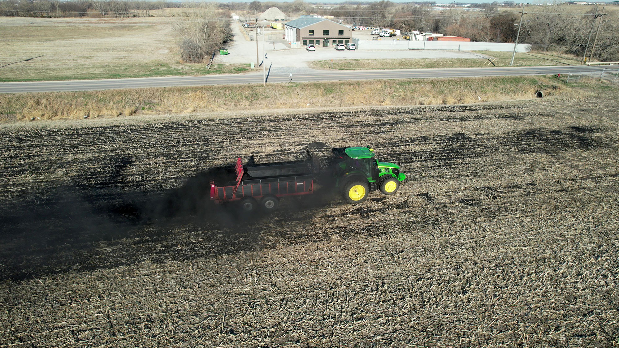 Biochar is applied to 16 acres of farmland in northeast Lincoln with a manure spreader, during University of Nebraska–Lincoln research trials in April. Photo by Ann Powers| Agronomy and Horticulture