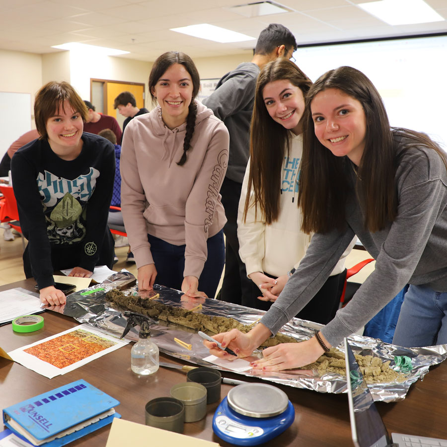 Sage Veomett, (left), Haley Klement, Abbie Cox and Gabrielle Clifton evaluate soil cores in Agronomy/Horticulture/Soil 153 Soil Resources class. Course is taught by Becky Young, assistant professor of practice in the Department of Agronomy and Horticulture.