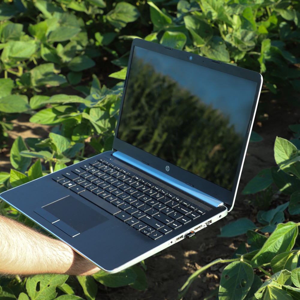 computer in soybean and corn fields