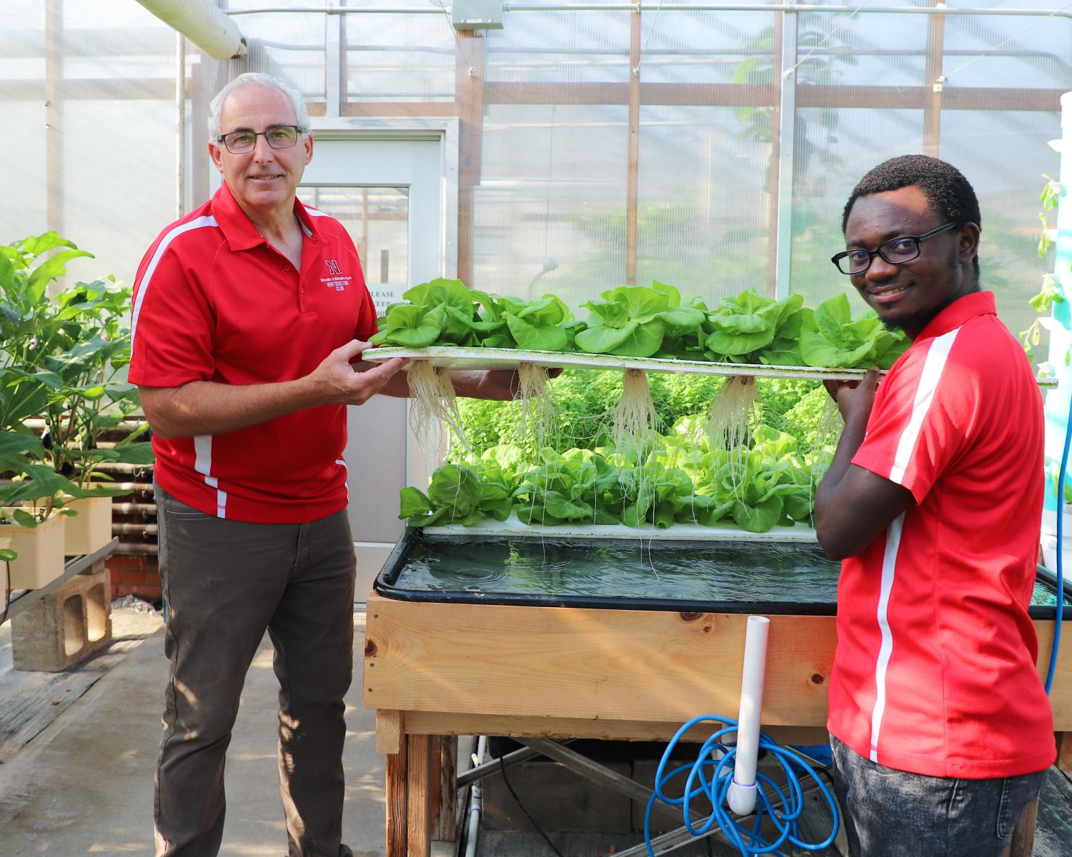 Stacy Adams, left, Department of Agronomy and Horticulture associate professor of practice, and Mark Iradukunda, senior integrated science major and summer research assistant.