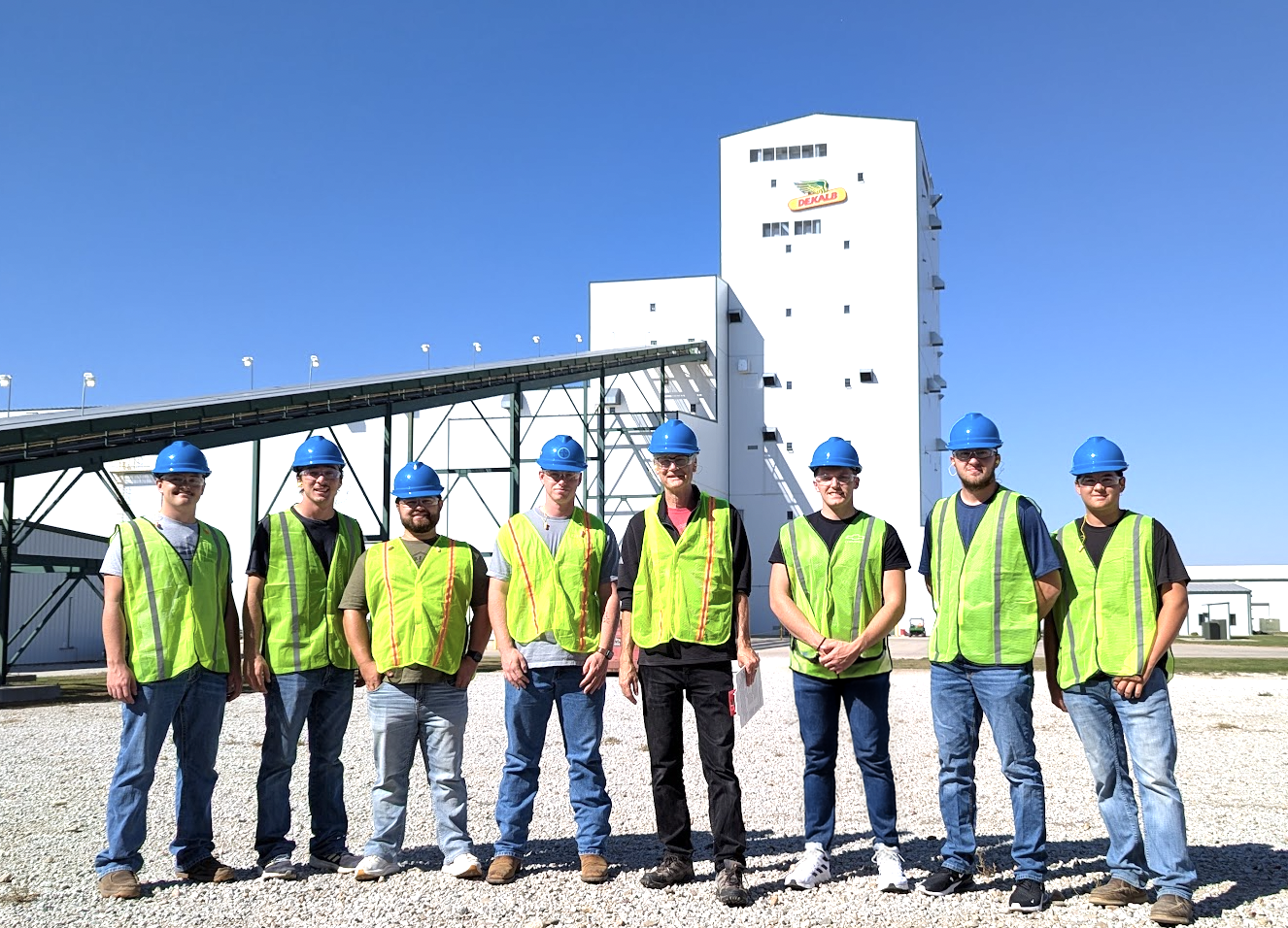 Students tour the Bayer Hybrid Seed Plant near Waco, Nebraska, Sept. 26 and include Nolan Eikerman (from left), Evan Smith, Carson Nagel, Brady Miller, Professor Don Lee, Xavier Ettwein, Payton Gangwish and Carson Ott. Dried ears are sent up this conveyor to the tower. As the seed moves down the tower, the remaining steps of processing are performed. 