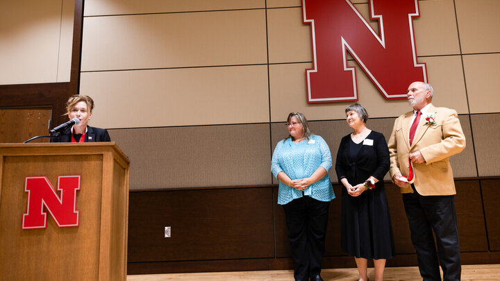 Tiffany Heng-Moss (left), interim vice chancellor for the Institute of Agriculture and Natural Resources, names Tamra Jackson-Ziems (second from left) as the John and Patty Wilson Professor of Plant Pathology.
