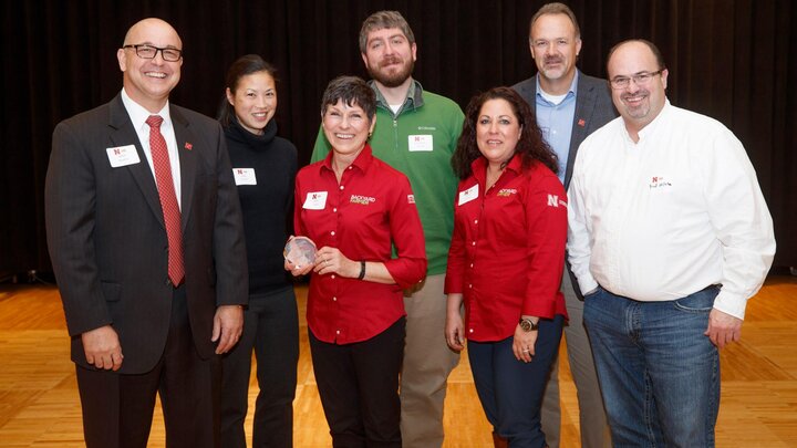 The Backyard Farmer Team receives the Omtvedt Innovation Award for Team. Pictured are IANR Harlan Vice Chancellor Mike Boehm (left), Jody Green, Kim Todd, Jonathan Larson, Terri James, Loren Giesler and Brad Mills. Photo by Craig Chandler / University Communications