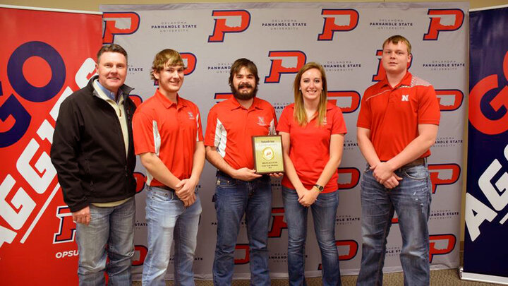 OPSU President Tim Faltyn (left) with Nebraska's winning team. Team members include agronomy senior Bryant Biskup, agronomy juniors Rodger Farr and Samantha Teten, and mechanized systems management senior Ian Fuchtman.