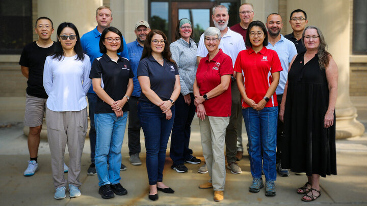 The Advancing Development of Assessments, Practices and Tools (ADAPT) project received a Grand Challenges catalyst award to help establish resilient, climate-smart beef production systems in Nebraska and beyond. Front row, from left, are:  Lidong Li, Yeyin Shi, Gwendwr Meredith, Susan Weller, Yijie Xiong and Sandi Christofferson. Back row, from left, are: Xiangmin (Sam) Sun, Marty Schmer, Jim MacDonald, Mary Drewnoski, Galen Erickson, Andy Suyker, Makki Khorchani and Ran Wang.