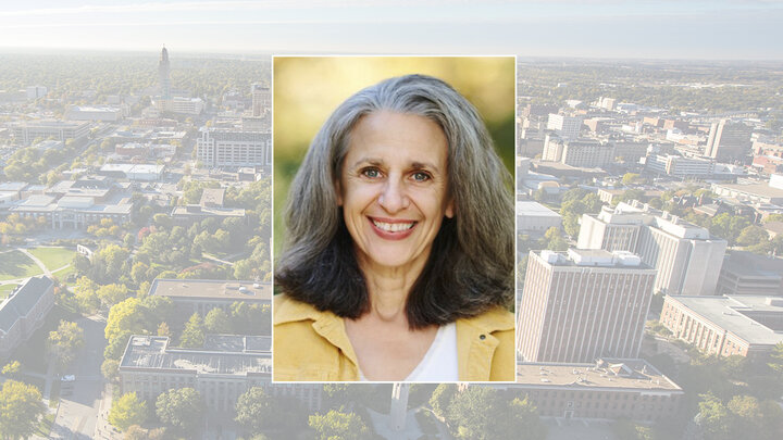 Color portrait of Tamar Haspel, food columnist for The Washington Post, on a color campus background.