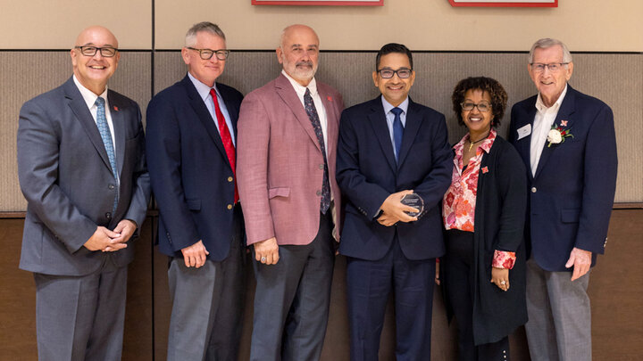 At the IANR Distinguished Faculty Banquet, Bijesh Maharjan, Nebraska Extension Soil Management Specialist received the Omtvedt Innovation Award. Pictured left to right, Mike Boehm, IANR Vice Chancellor, John Westra, Director Panhandle Research Extension and Education Center, Charlie Stoltenow, Dean and Director of Extension at UNL, Maharjan, Martha Mamo, UNL Department Head of Agronomy and Horticulture, and Irvin Omtvedt, UNL Emeritus Professor. 