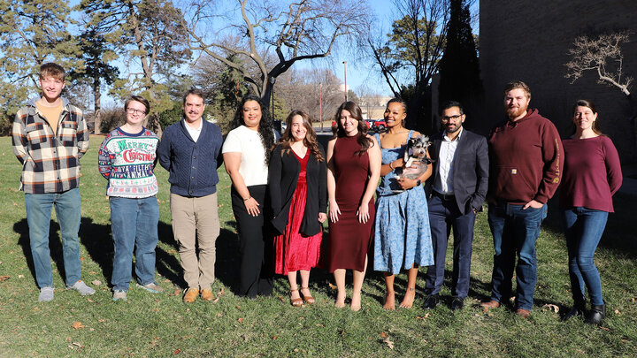 Agronomy and Horticulture graduate and undergraduate students Xavier Fiala (from left), Ryleigh Kirby, Ezequiel Villamil, Pratiksha Baishya, Alyssa Hall, Stephanie Lugo, Bellodgia Roberson, Vipin Kumar, Cameron Grabenstein and Sarah Magee celebrate with family and friends at the departmental graduation celebration Dec. 19. 