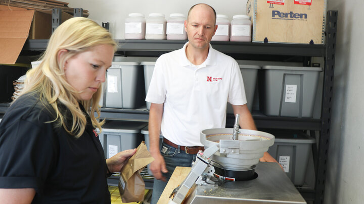 Amanda Easterly, research assistant professor, and Cody Creech, associate professor, testing wheat samples at the High Plains Ag Lab. 