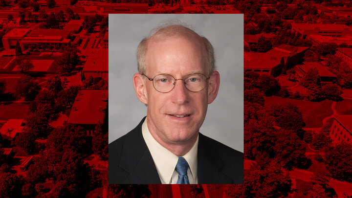 Portrait of Richard Fergson with red background of East Campus