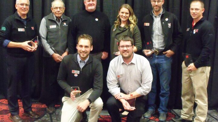 Hail Know team members Justin McMechan (front row, left to right), Nathan Mueller, Roger Elmore (back row, left to right), Robert Klein, Daren Redfern, Ashley Mueller, Chris Proctor and Tyler Williams receive the Excellence in Extension Team award.