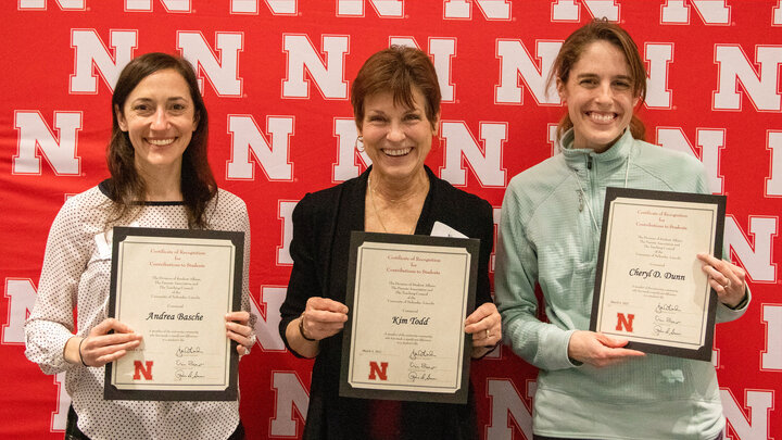 Andrea Basche, left, Kim Todd and Cheryl Dunn are honored at the 2022 Parentsâ Recognition Awards ceremony March 4. Mike Jackson | Student Affairs Marketing & Communication