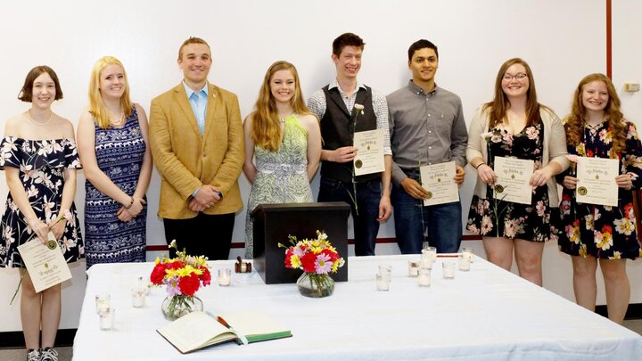 Amanda Earnest (from left), Zoe Gildersleeve, Ben Searl, Olivia Fiala, Jason Ries, Michael Miller, Morgan Von Seggern and Kaitlin Taylor are inducted into Pi Alpha Xi. Not pictured is Alexander Monette.  