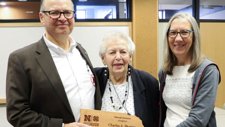 Charles Shapiro, from left, with his mother Edith Shapiro and wife Joan Sudmann Shapiro celebrate at the Department of Agronomy and Horticulture retirement reception held in his honor.