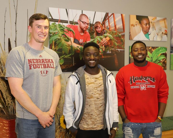 Ryan Dorn, left, Patience Gihozo and Christian Nduwumwami.