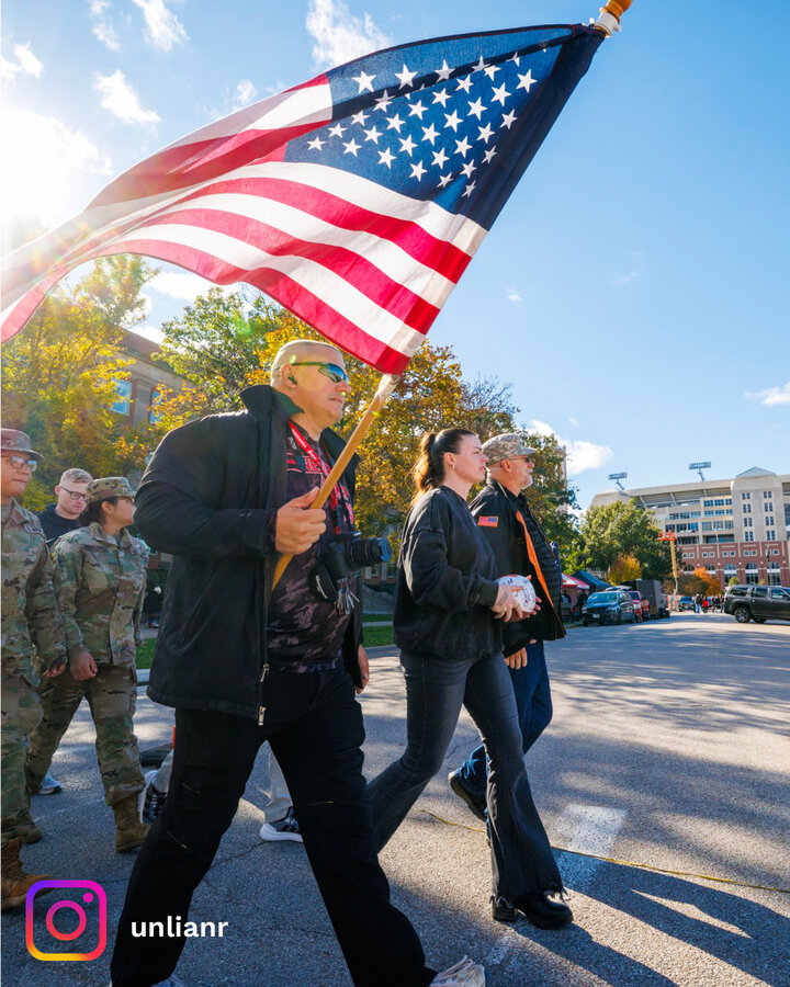 After more than 50 miles on foot from Omaha to Lincoln, UNL student veterans completed the final stretch of their annual ruck march to Memorial Stadium, delivering the game ball to Troy Dannen, athletic director. 