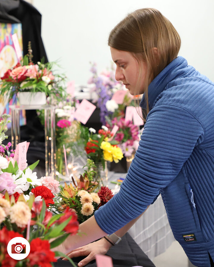 Laura Albro, a senior agronomy major, prepares her floral pop-up store for customers Feb. 13 in Plant Science Hall, Room 264.