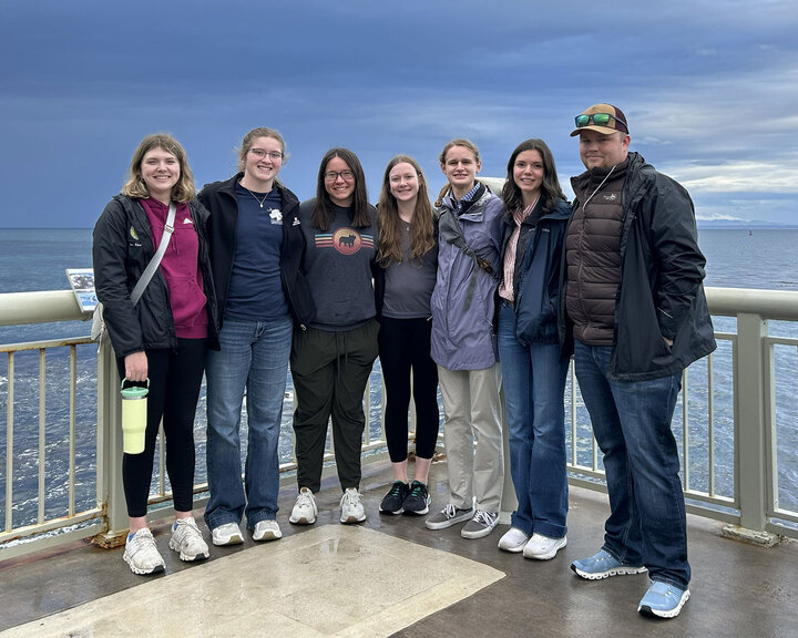 Members of the 2026 Range Management Team stand by the ocean in Monterey, California.