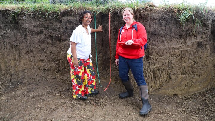 Martha Mamo  and Becky Young in soil pit