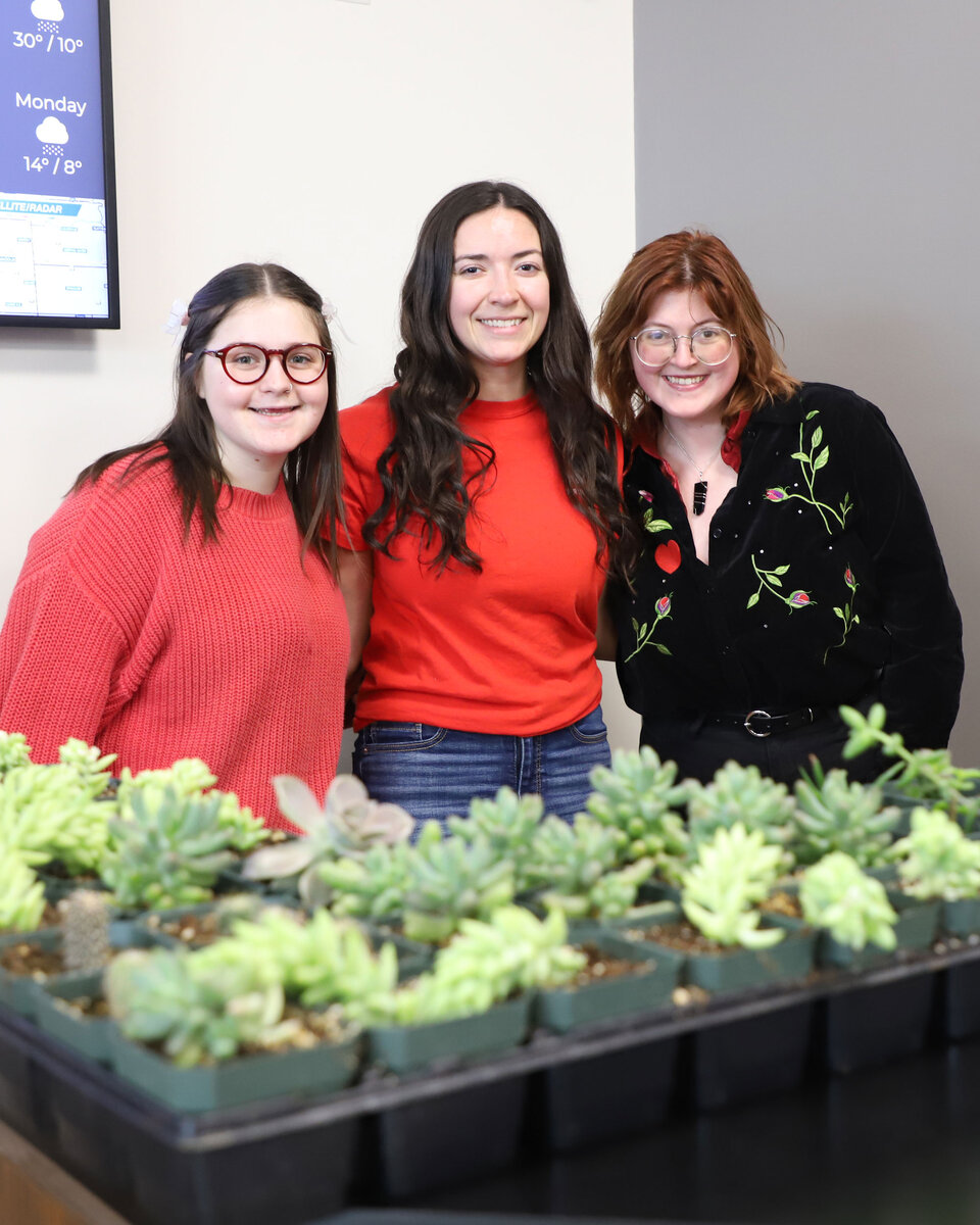 Horticulture Club members sell succulent plants at the club's Valentine's Day plant sale.