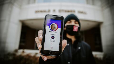 Nebraska’s Yajvoo Shrestha shows the Safer Community app to be used as part of COVID testing on campus this spring. Craig Chandler | University Communication