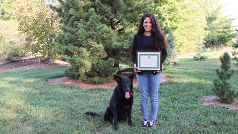 Kristina Alas with her certified therapy dog Lucy.