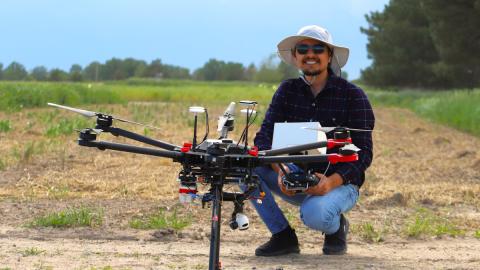 Deepak Ghimire, a Ph.D. candidate at the University of Nebraska-Lincoln Department of Agronomy and Horticulture, holds a drone he uses to take images of crop research plots. Photo by Nicole Heldt