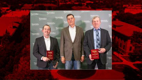 Mitchell Stephenson, left, and Tommy Wheeler receive awards from Ryan Loseke, center, President Nebraska Cattlemen, at the Nebraska Cattlemen Annual Convention and Trade Show banquet. Photo courtesy of the NC