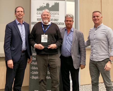 Richard K. Sutton (second from left) receives the Career Research Award in Green Roof Research from Green Roofs for Healthy Cities Research Committee Chair Reid Coffman (left), Green Roofs for Healthy Cities CEO Steven Peck (third from left) and Gray to Green Conference Chair Joe Barmore (right) Oct. 29 at the Gray to Green Conference in Washington, D.C.